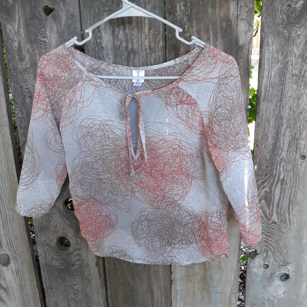 Orange and brown transparent tunic style shirt.